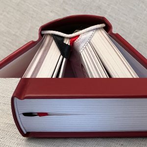 3 ribbon markers in hardcover book.