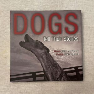 Dogs Tell Their Stories, words by Rex Paul Martin, photographs by Marcy Merrill, a hardcover coffee table book.