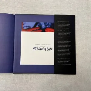 Booklet inside pocket glued to the inside back cover. Premium book printing in Asia.