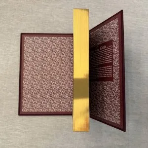 Gilded edge on text block and endpapers.